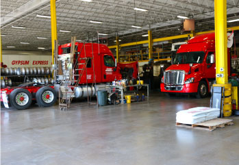 Baldwinsville, NY shop trucks in facility